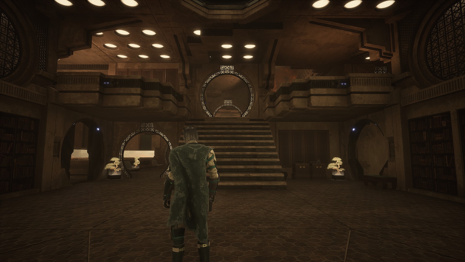 Main interior hall with stairs and circular doors