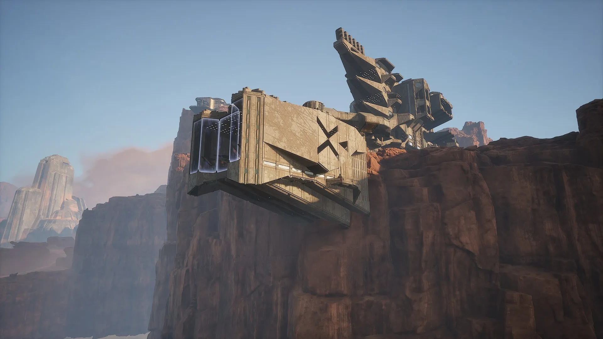 Xenth Kartel Operations cliffside exterior
