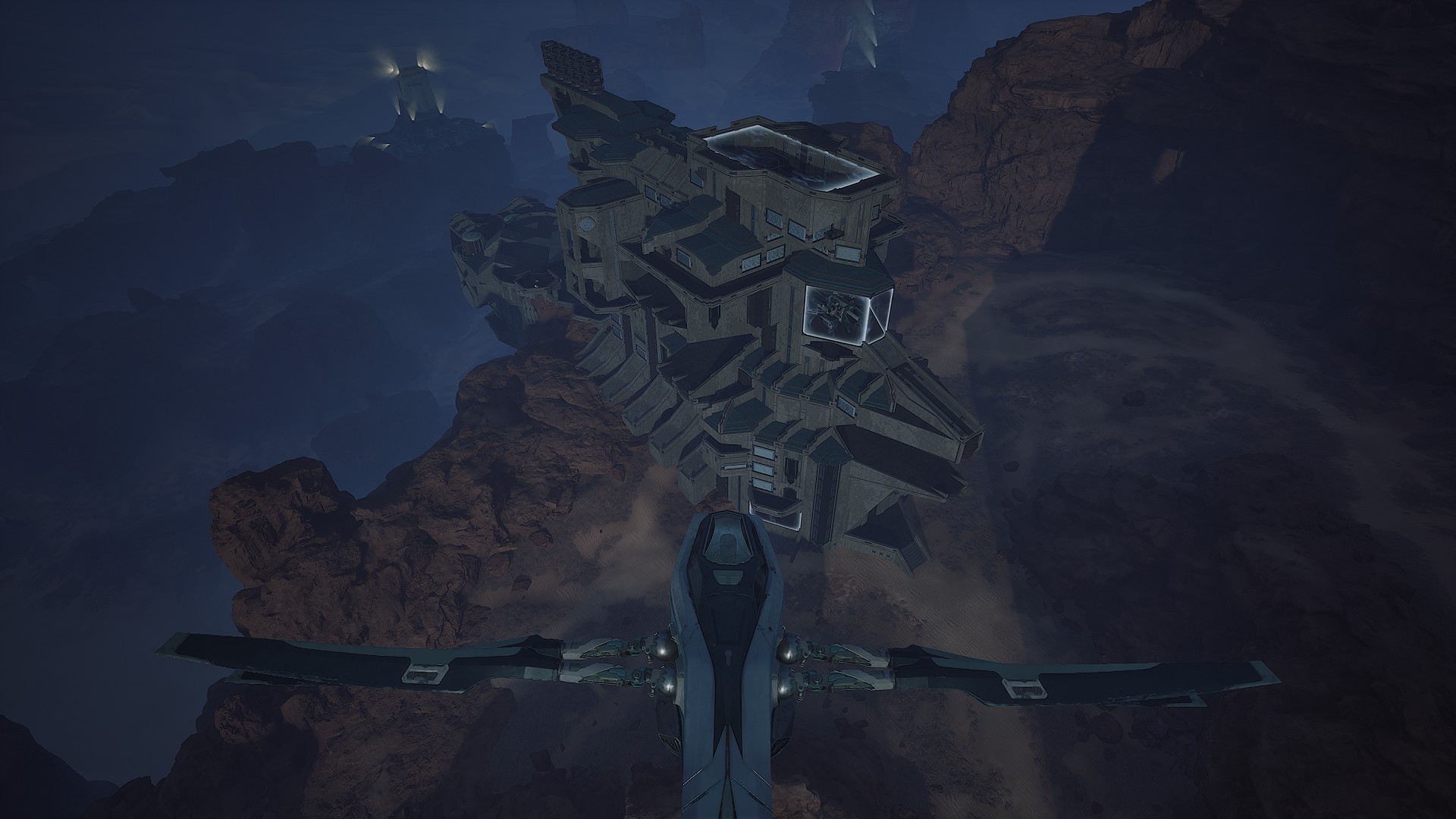 Night aerial approach over the Operations hub